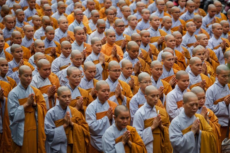 Buddhist monks pray for late Vietnam's President Tran Dai Quang at the Viet Nam Quoc Tu Pagoda in Ho Chi Minh City. Kao Nguyen/AFP