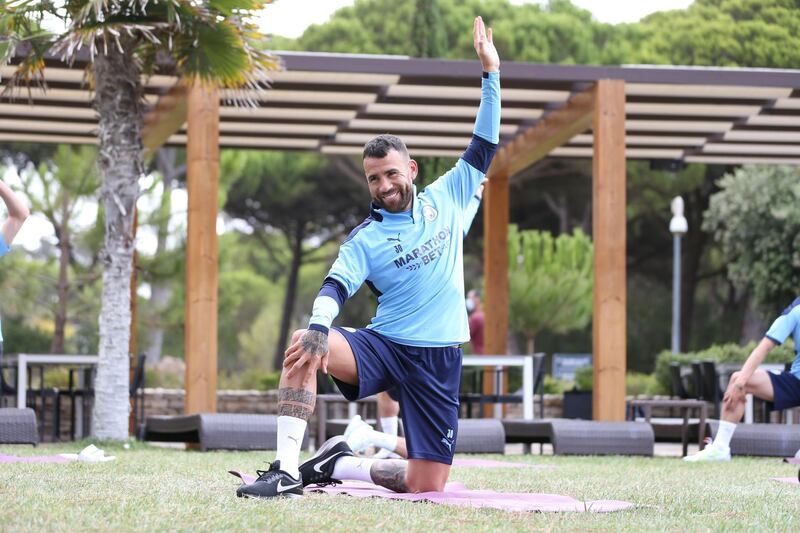 LISBON, PORTUGAL - AUGUST 11: Nicolas Otamendi of Manchester City takes part in a stretching session in the build up to the UEFA Champions League Quarter Final match at the team hotel on August 11, 2020 in Lisbon, Portugal. (Photo by Victoria Haydn/Manchester City FC via Getty Images)