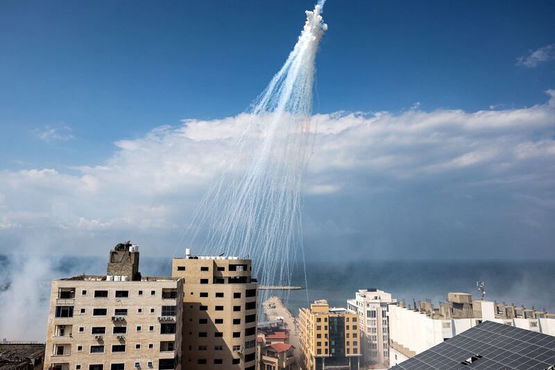 Human Rights Watch claims these are bursts of artillery-fired white phosphorus over the Gaza city port on October 11. Getty / AFP
