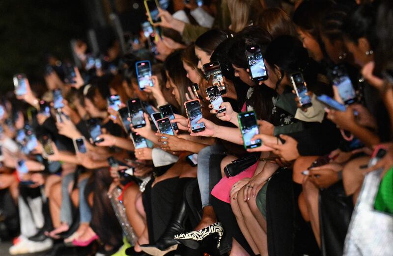 Guests record the Boohoo by Kourtney Kardashian show during New York Fashion Week in New York city.  AFP