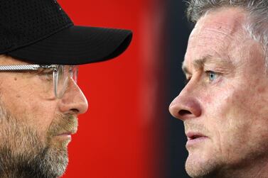 Liverpool manager Jurgen Klopp, left, with his Manchester United counterpart Ole Gunnar Solskjaer. Getty