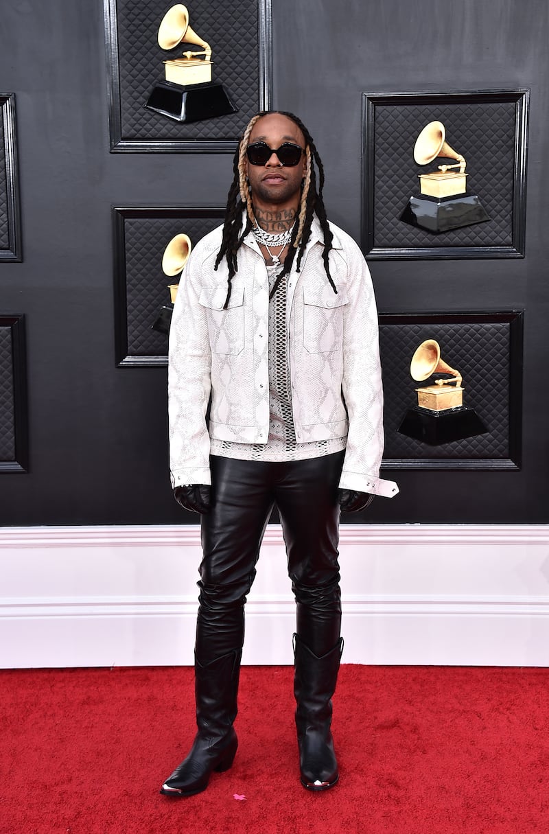 Ty Dolla $ign, wearing a snake skin jacket over leather trousers. AP