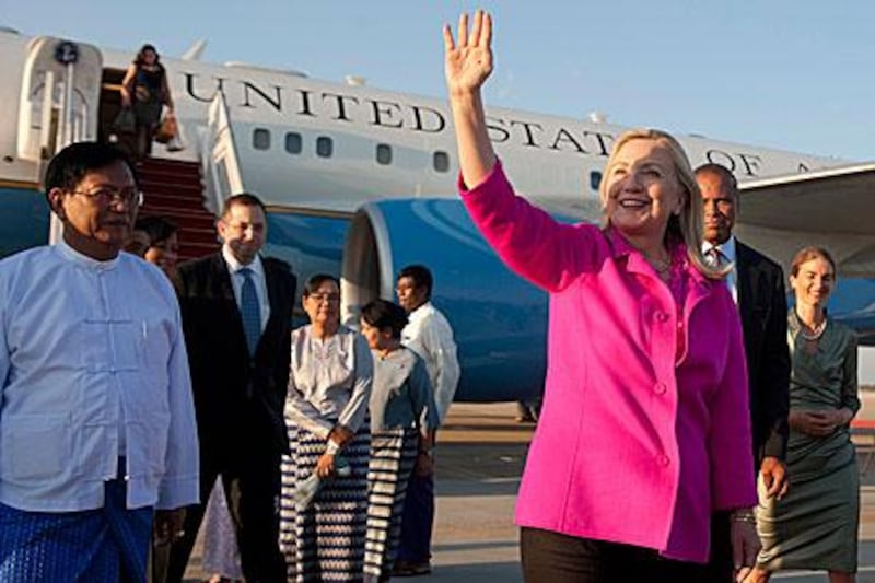 Hillary Clinton, the US secretary of state, is welcomed to Myanmar by the country’s deputy foreign minister  Myo Myint, left, in Naypyitaw yesterday.