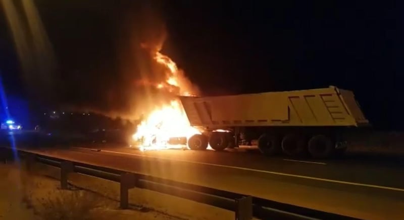 A screen grab from a video supplied by RAK Police showing firefighters working to extinguish a truck fire. Courtesy RAK Police