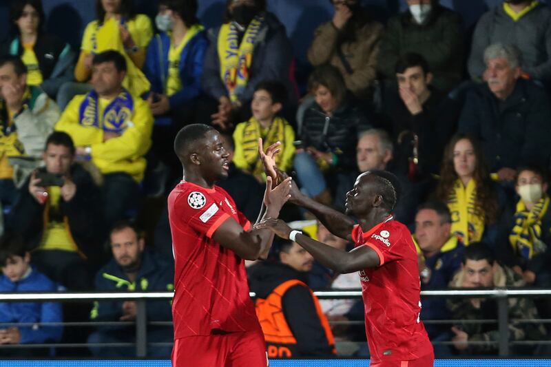 Sadio Mane celebrates with Ibrahima Konate after scoring the  third goal. AP