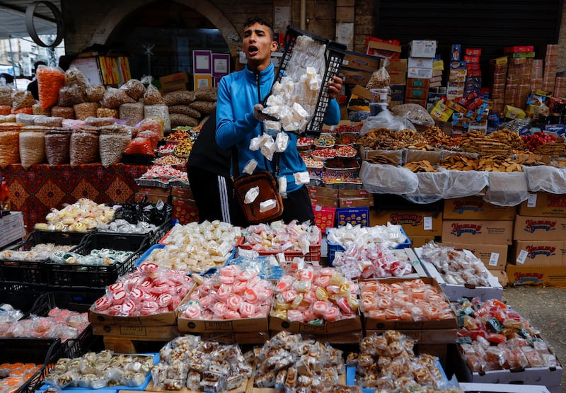 A vendor selling sweets as Palestinians prepare for the Eid Al Fitr holiday in Khan Younis, the southern Gaza Strip. Reuters