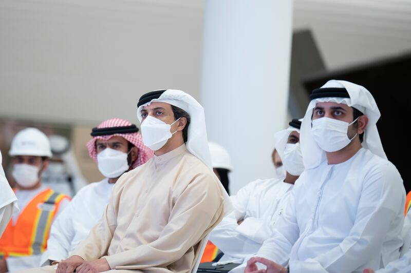 Sheikh Mansour bin Zayed, Deputy Prime Minister and Minister of Presidential Affairs, left, and Sheikh Maktoum bin Mohammed, Deputy Prime Minister and Minister of Finance, right, at the announcement of the Emirates Railways Program 'Etihad Rail', in the UAE pavilion at Expo 2020 Dubai.