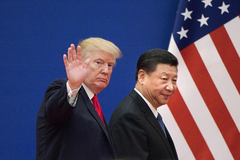 (FILES) In this file photo taken on November 9, 2017 shows US President Donald Trump (L) and China's President Xi Jinping leaving a business leaders event at the Great Hall of the People in Beijing. - US President Donald Trump on August 24, 2018 announced the cancellation of his top diplomat's upcoming visit to North Korea, while taking a swipe at China over efforts to disarm the nuclear state. Trump says China is not 'helping' with North Korea. "Additionally, because of our much tougher Trading stance with China, I do not believe they are helping with the process of denuclearization as they once were (despite the UN Sanctions which are in place)," Trump said. (Photo by Nicolas ASFOURI / AFP)