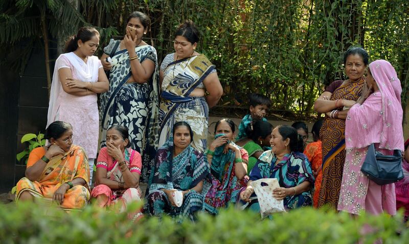 Indian women gather outside the residence of Bollywood actress Sridevi . Many have travelled hundreds of kilometres to catch a glimpse of the actress before she is buried. Punit Paranjpe / AFP Photo