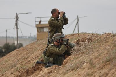 Israeli soldiers monitoring the Shujayya neighbourhood in the Gaza Strip on Thursday. EPA