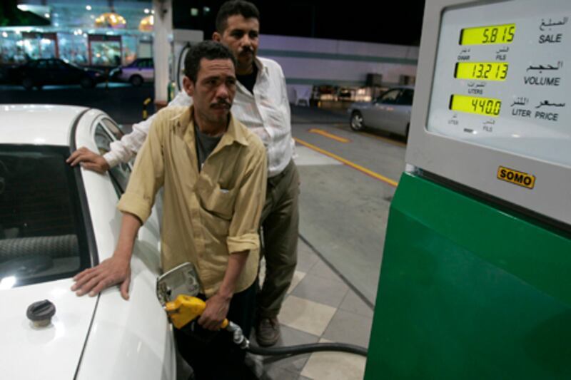 A driver fills up his car at a gas station in Amman, Jordan, Thursday, August, 13, 2009,as the government issued new fuel prices. (AP Photo/Nader Daoud)