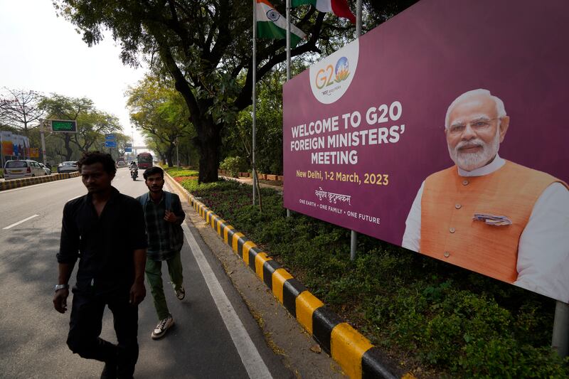 A banner with Indian Prime Minister Narendra Modi's picture welcomes delegates to New Delhi. AP