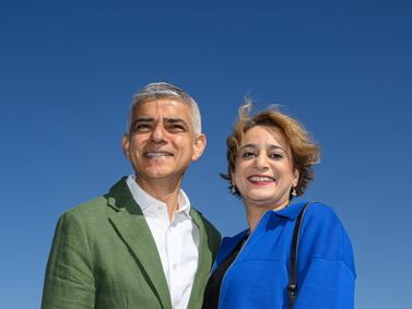 LONDON, ENGLAND - MAY 7: London Mayor Sadiq Khan and his wife Saadiya Khan pose for photos as they walk across the Millennium Bridge ahead of his swearing in for a third term on May 7, 2024 in London, England. Sadiq Khan was re-elected as Mayor of London for a historic third term on Saturday. The Labour incumbent won 1,088,225 votes giving him a majority of 275,828 over the Conservative candidate Susan Hall. (Photo by Leon Neal / Getty Images)