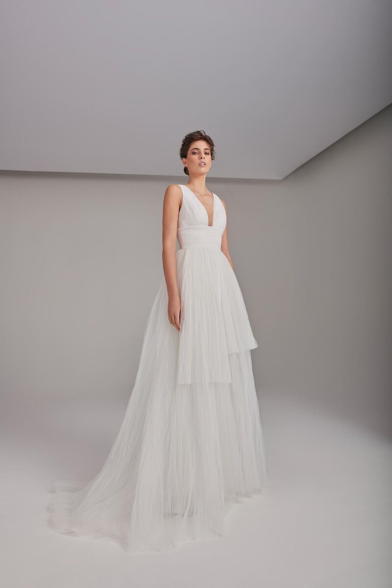 This tiered gown is priced at Dh12,560. Courtesy Rami Al Ali