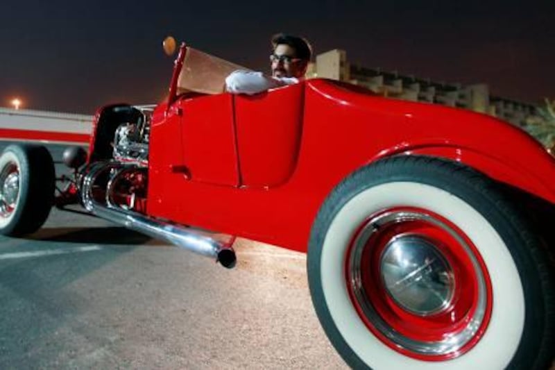 Dubai, United Arab Emirates- June  13, 2011:   Gaurav Dhar  pose next  to his  1930's hot rod at  the Motorcity in Dubai .  ( Satish Kumar / The National ) For Motoring