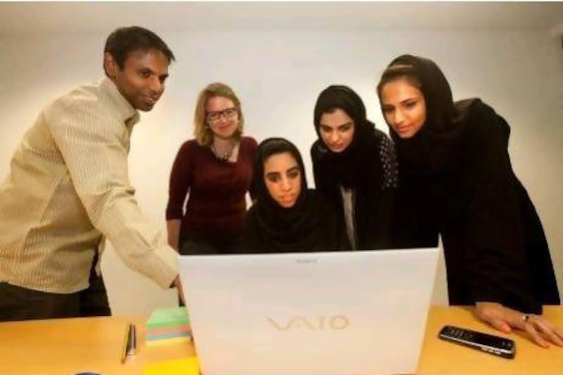 From left, MindTalk's Satheesh Kumar, Christiane Schloderer, Azza AlNuaimi, Meerah Ketait and Sarah Al Qassimi during a meeting at their office in Deira last week.