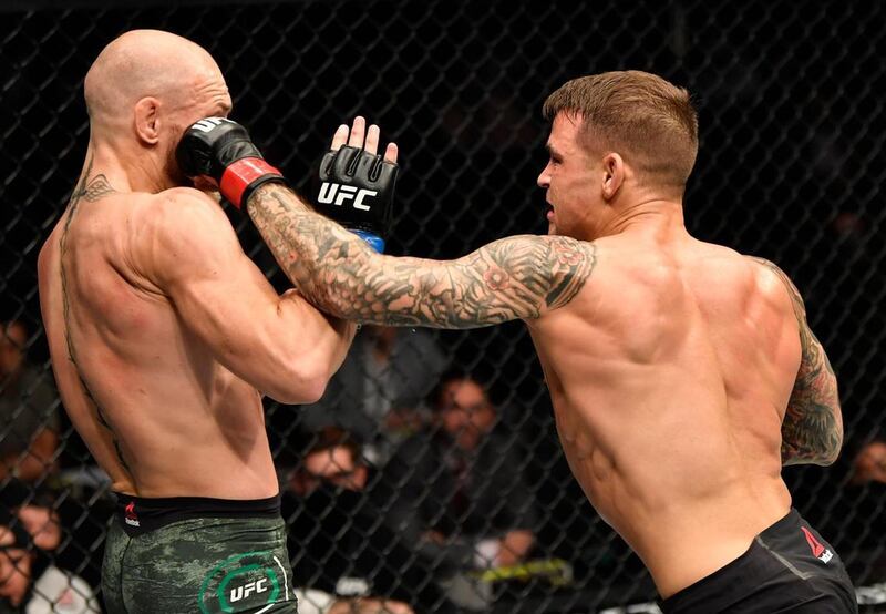 Dustin Poirier punches Conor McGregor. Jeff Bottari/Zuffa LLC
