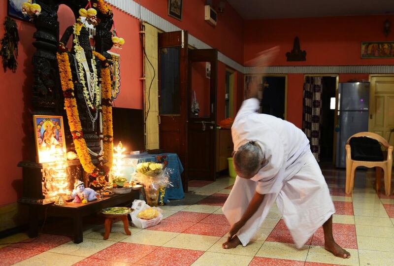 Indian monk Swami Sivananda practises yoga in Kolkata.