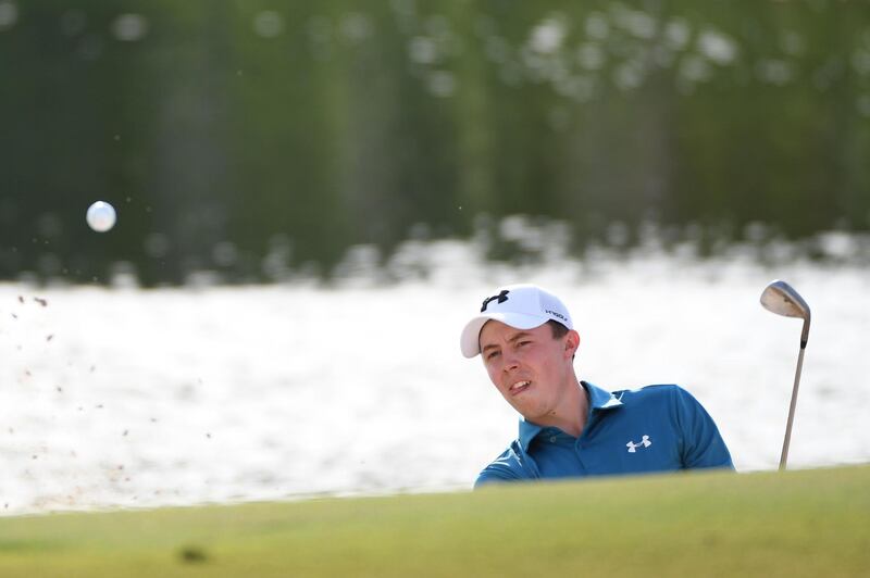 Matthew Fitzpatrick hits his second shot on the 17th hole during the second round of the DP World Tour Championship. Ross Kinnaird / Getty Images