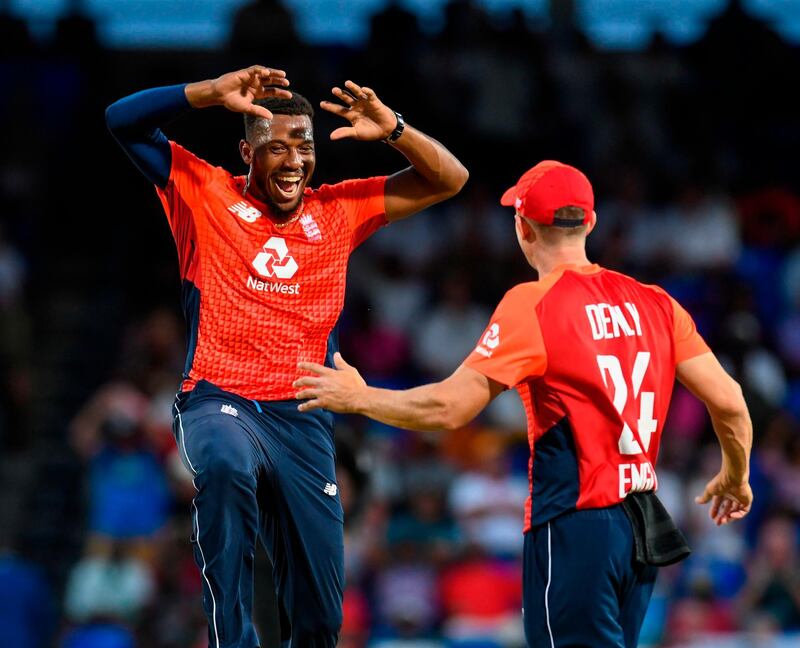 Chris Jordan (L) of England celebrates the dismissal of Fabian Allen of West Indies during the 2nd T20I between West Indies England at Warner Park, Basseterre, Saint Kitts and Nevis, on March 08, 2019. / AFP / Randy Brooks
