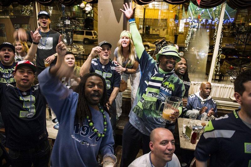 Seattle Seahawks fans celebrate as they watch the Super Bowl at a restaurant in downtown Seattle, Washington on Sunday. Dan Levine / EPA