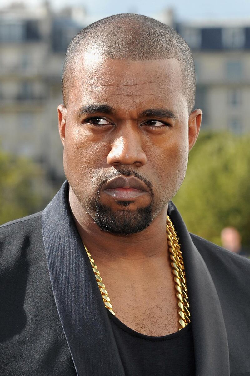 PARIS, FRANCE - SEPTEMBER 28: Kanye West arrives at the Christian Dior Spring / Summer 2013 show as part of Paris Fashion Week on September 28, 2012 in Paris, France.  (Photo by Pascal Le Segretain/Getty Images) *** Local Caption ***  AL17JL-CROWNS-KANYE.jpg