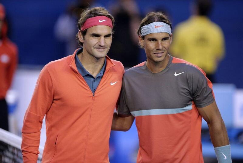Roger Federer, left, is targeting a return to full fitness in time for the start of the 2017 season. Rick Rycroft / AP Photo