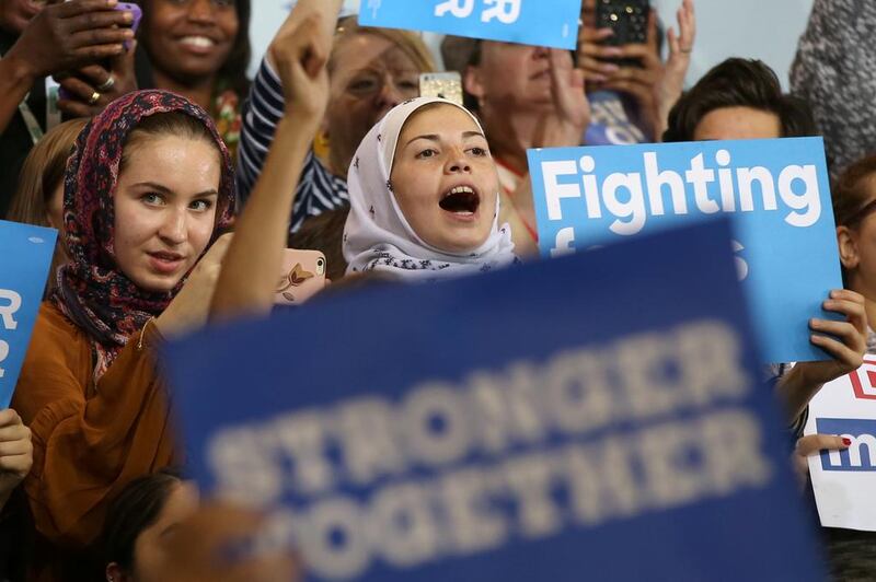 Women wearing headscarves listen to Hillary Clinton speak at a voter registration rally in Detroit, Michigan, on October 10, 2016. Lucy Nicholson / Reuters