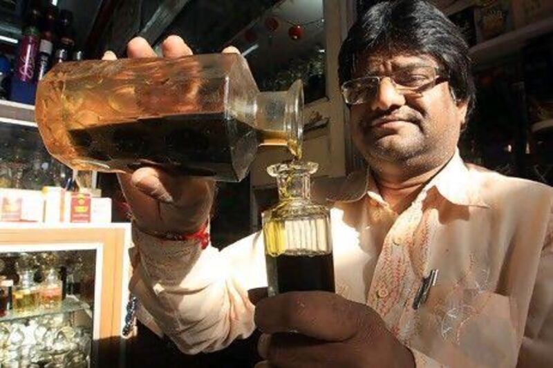 Dinesh Kothari, the owner of Bhagwan & Co perfumers, pours attar into small glass bottles in Old Hyderabad City. He is a third-generation fragrance-master but fears that his art will soon die out.