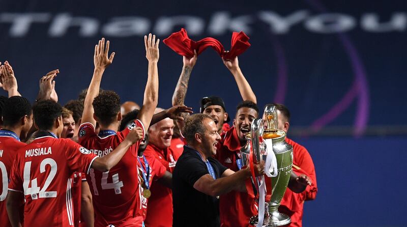 Bayern's coach Hansi Flick holds the Champions League trophy. AP