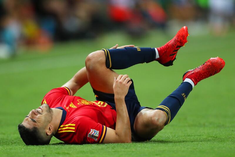 Carlos Soler of Spain lays on the field injured. Getty Images
