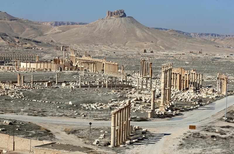 The Fakhr al-Din II's citadel overlooks the ancient Roman-era city of Palmyra with a view of the Great Colonnade on February 7, 2021 in Syria's central province of Homs. - Syria has six sites listed on the UNESCO elite list of world heritage and all of them sustained some level of damage in the 10-year war. Besides Palmyra and Aleppo, the ancient cities of Damascus and Bosra also sustained some damage. (Photo by LOUAI BESHARA / AFP)