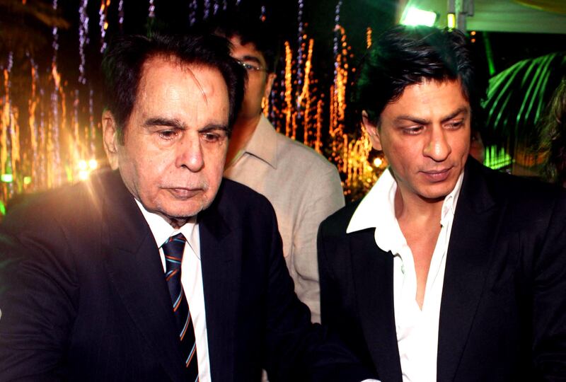 Dilip Kumar with Shah Rukh Khan during Kumar's 89th birthday celebrations in Mumbai on December 11, 2011.