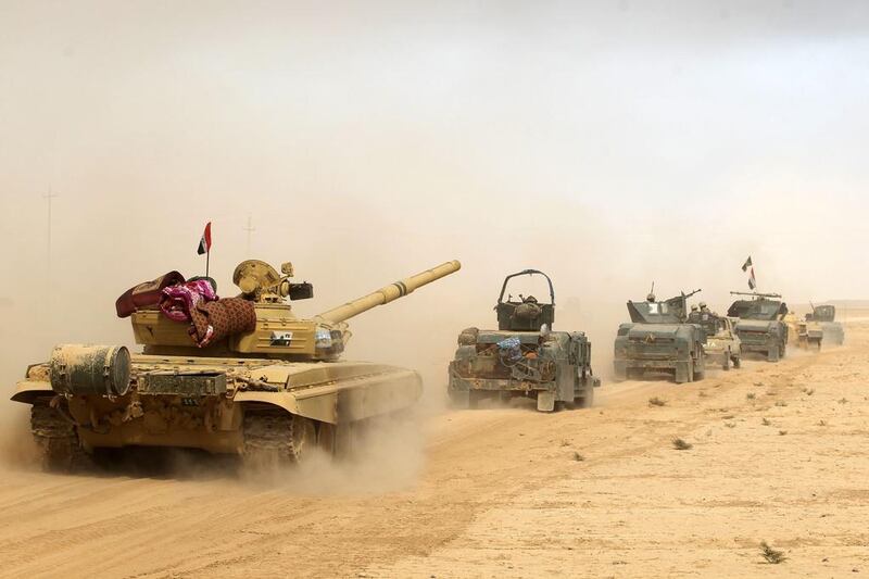 Iraqi forces deploy in Al Shurah, some 45 kilometres south of Mosul, on October 17, 2016, as they advance towards the city to retake it from ISIL. Ahmad Al Rubaye/AFP