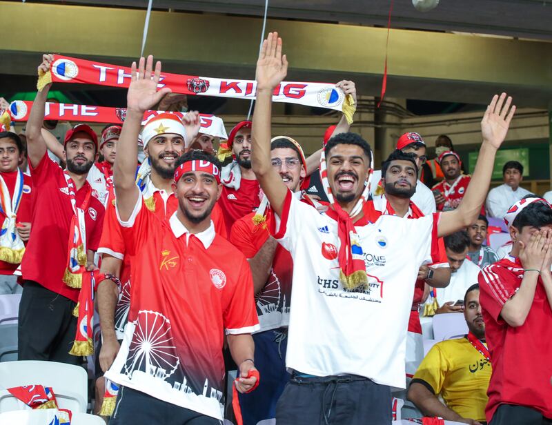 Sharjah FC fans cheer during the President’s Cup finals match at the Hazza bin Zayed Stadium in Al Ain. Victor Besa / The National