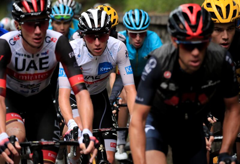 Slovenian rider Tadej Pogacar (2-L) of the UAE-Team Emirates in action during the 8th stage of the Tour de France 2021 over 150. 8 km from Oyonnax to Le Grand-Bornand, France, 03 July 2021.   EPA / CHRISTOPHE PETIT-TESSON