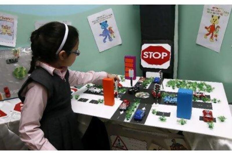 Sarah Mohammed Fahad, a Grade 3 student, learns traffic and road safety through models and toys in Al Ansar International School.