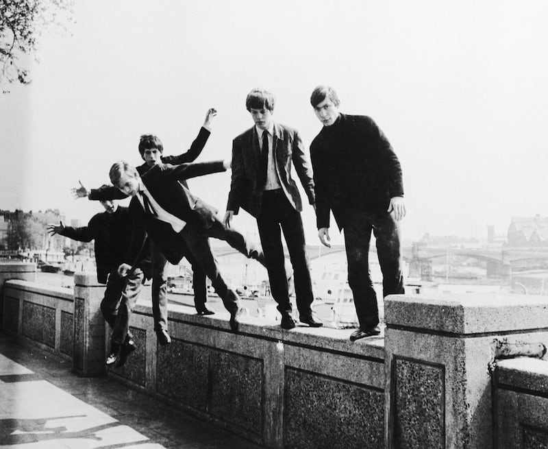 The Rolling Stones messing about on a wall at Embankment, London, circa 1963. (Photo by Keystone Features/Hulton Archive/Getty Images)