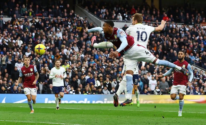 Spurs striker Harry Kane heads at goal in first half. Reuters