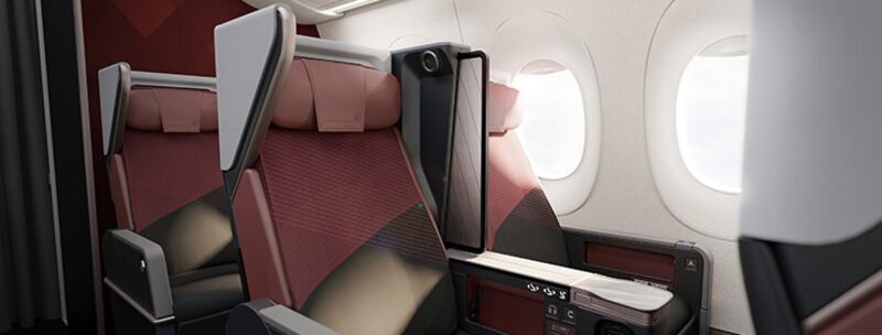 Premium economy class features larger dividers between seats