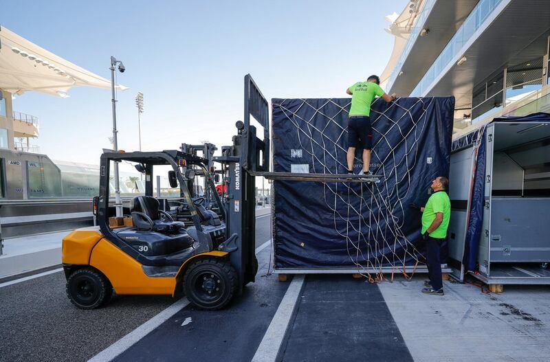 Abu Dhabi, United Arab Emirates, November 26, 2019.    Abu Dhabi grand Prix  preparations 2019.-- Red Bull technicians unloading the crates at the pit stop area.Victor Besa / The NationalSection:  SPReporter:  Simon Wilgress-Pike