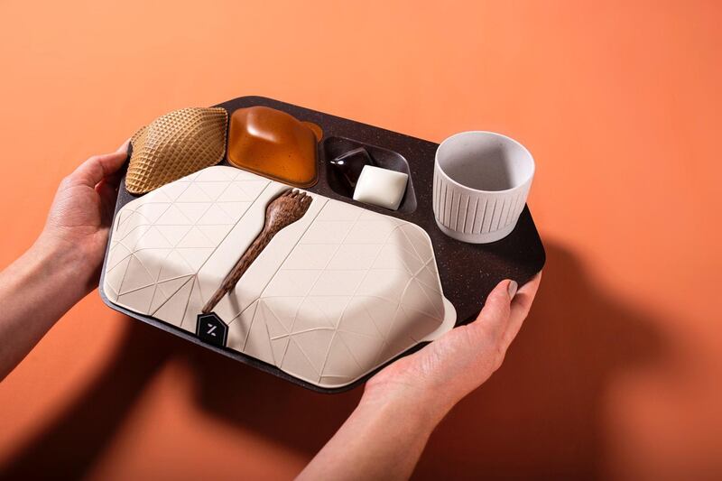Priestman Goode's Zero Waste swaps single-use plastic for ground coffee beans and rice husk in its overhaul of throwaway cabin trays. Courtesy Priestman Goode.