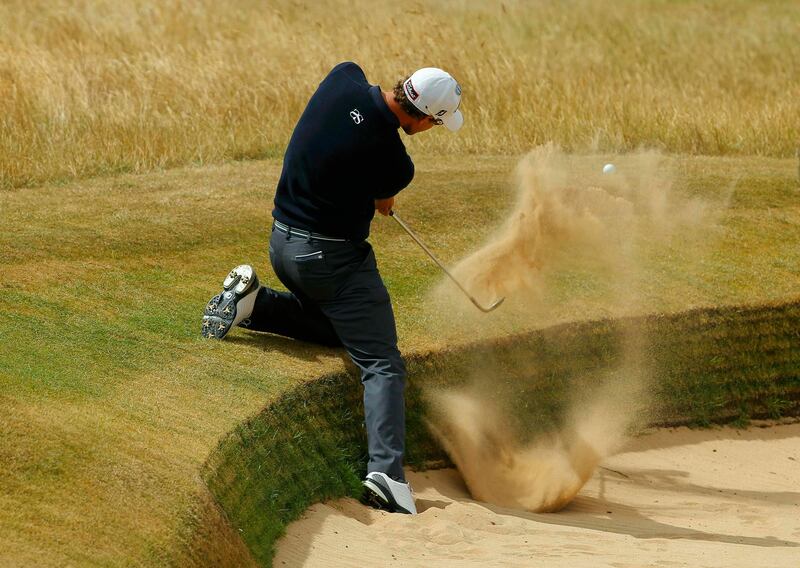 Adam Scott of Australia hits out of a bunker on the first hole during the final round of the British Open golf Championship at Muirfield in Scotland July 21, 2013. REUTERS/Brian Snyder (BRITAIN  - Tags: SPORT GOLF)   *** Local Caption ***  LON718_GOLF-OPEN-_0721_11.JPG