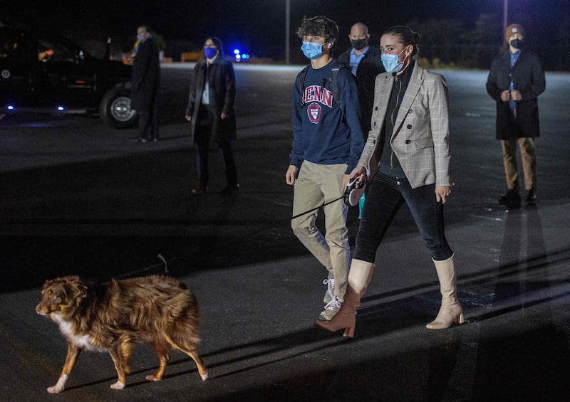 Joe Biden's grandchildren, Naomi Biden and Robert Hunter Biden, walk her dog Charlie at Nantucket Memorial Airport in Massachusetts last Thanksgiving. EPA