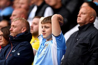 A Coventry City fan in the stands watches the match action Bolton Wanderers v Coventry City - Sky Bet League One - University of Bolton Stadium 10-08-2019 . (Photo by  Dave Howarth/PA Images via Getty Images)