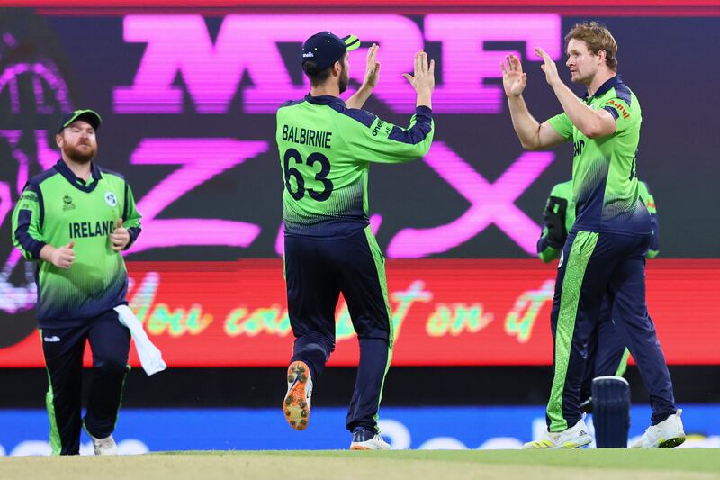 Ireland's Barry McCarthy, right, is congratulated by his captain Andrew Balbirnie after dismissing Australia's Mitchell Marsh. AP 