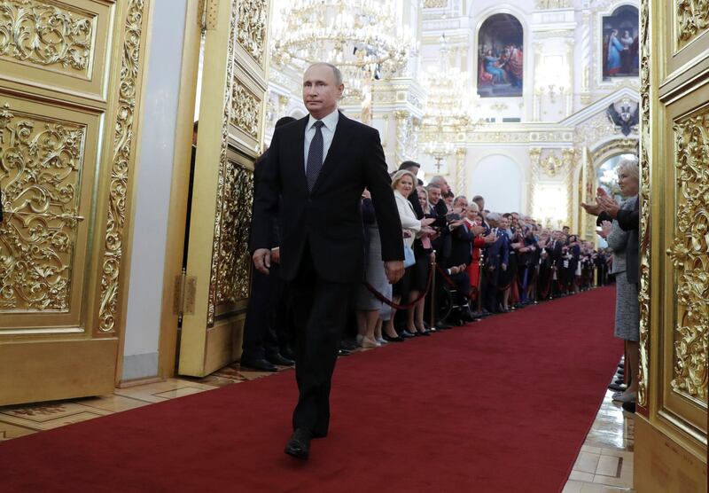 Vladimir Putin walks before an inauguration ceremony at the Kremlin in Moscow. Mikhail Metzel / Reuters