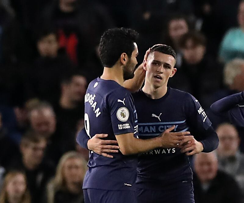 Manchester City's Phil Foden celebrates scoring their second goal against Brighton with Ilkay Gundogan. City won the match 4-1 at Amex Stadium on October 23, 2021. Reuters