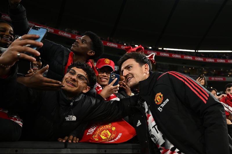 Harry Maguire of Manchester United with fans at the Melbourne Cricket Ground. EPA