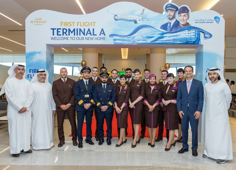 Etihad Airways flight crew ready for the inaugural flight from Terminal A, where the airline will offer biometric bag drops